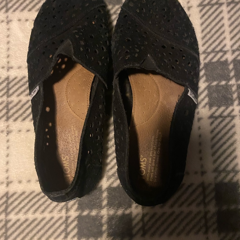 Toms black, perforated design flat shoes. Women’s size 9.